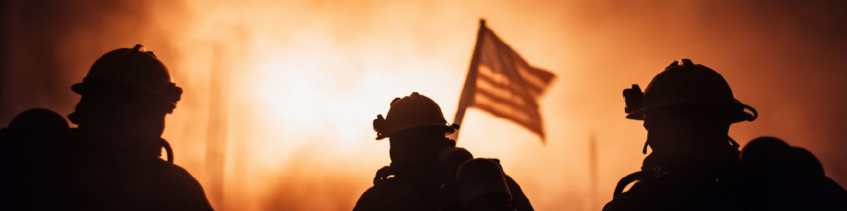 Firefighter lifestyle apparel shot – silhouettes of firefighters and U.S. flag in front of blazing fire, Septic & Salty Supply Co.