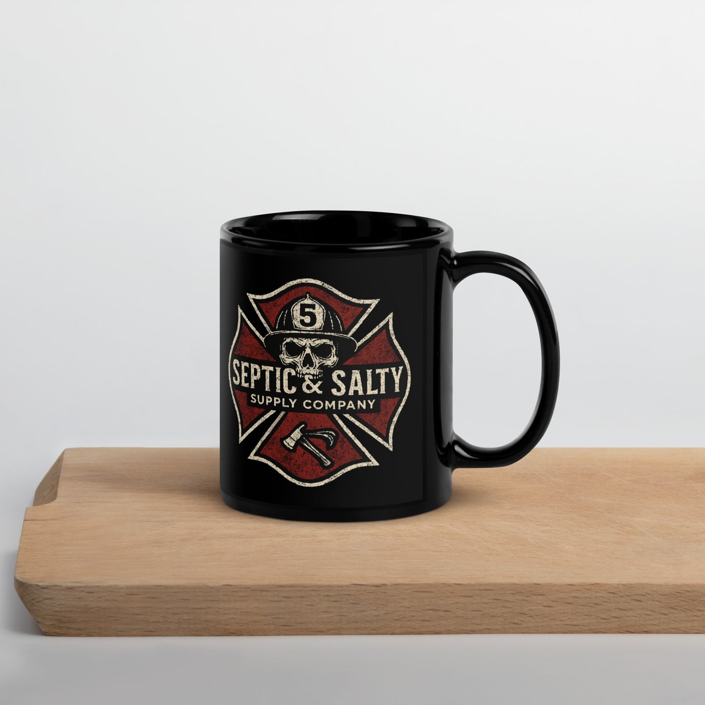 Black mug with 'Septic & Salty Supply Company' logo on a wooden surface