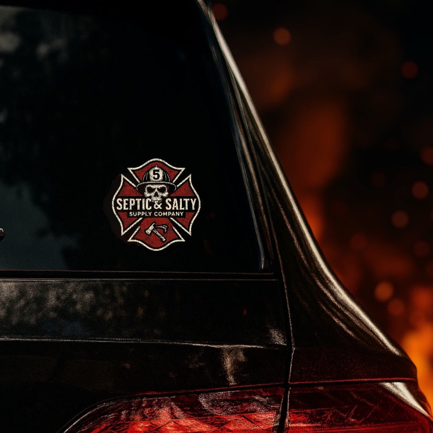 Septic & Salty Maltese Skull firefighter sticker with distressed cross, skull, and axe design on black vinyl.