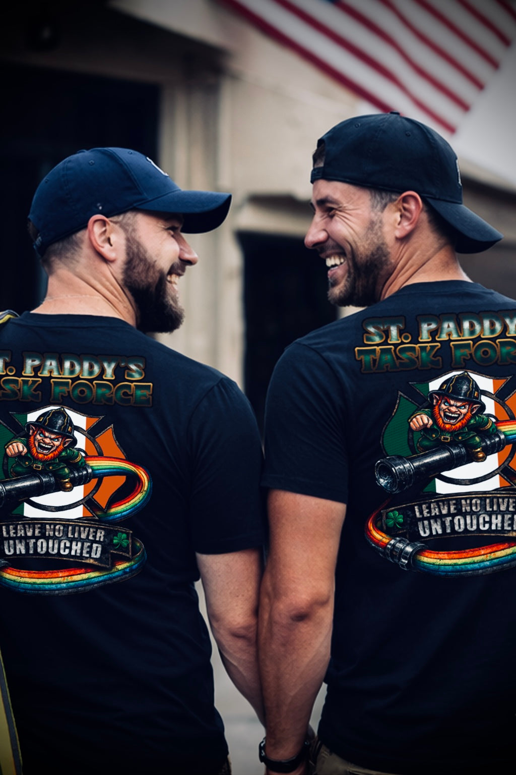 Two men wearing black t-shirts with graphic designs and text, standing side by side.