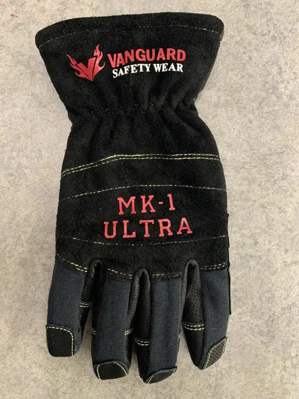 Black glove with 'Vanguard Safety Wear' branding on a gray background