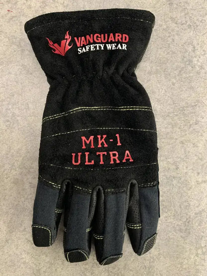 Black glove with 'Vanguard Safety Wear' branding on a gray background